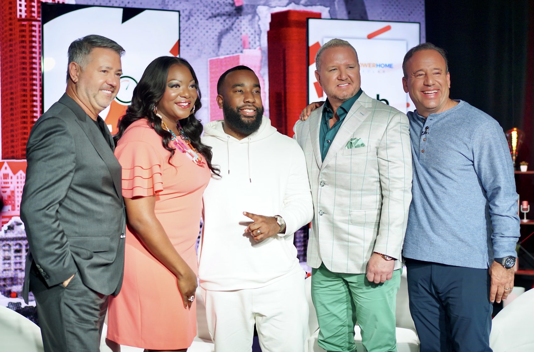 Shawn Anthony on stage with Teri Ijeoma and fellow founders
