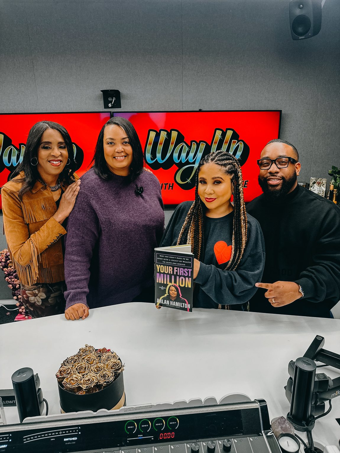 Arlan Hamilton with her book alongside Angela Yee and Shawn Anthony in the Way Up studio